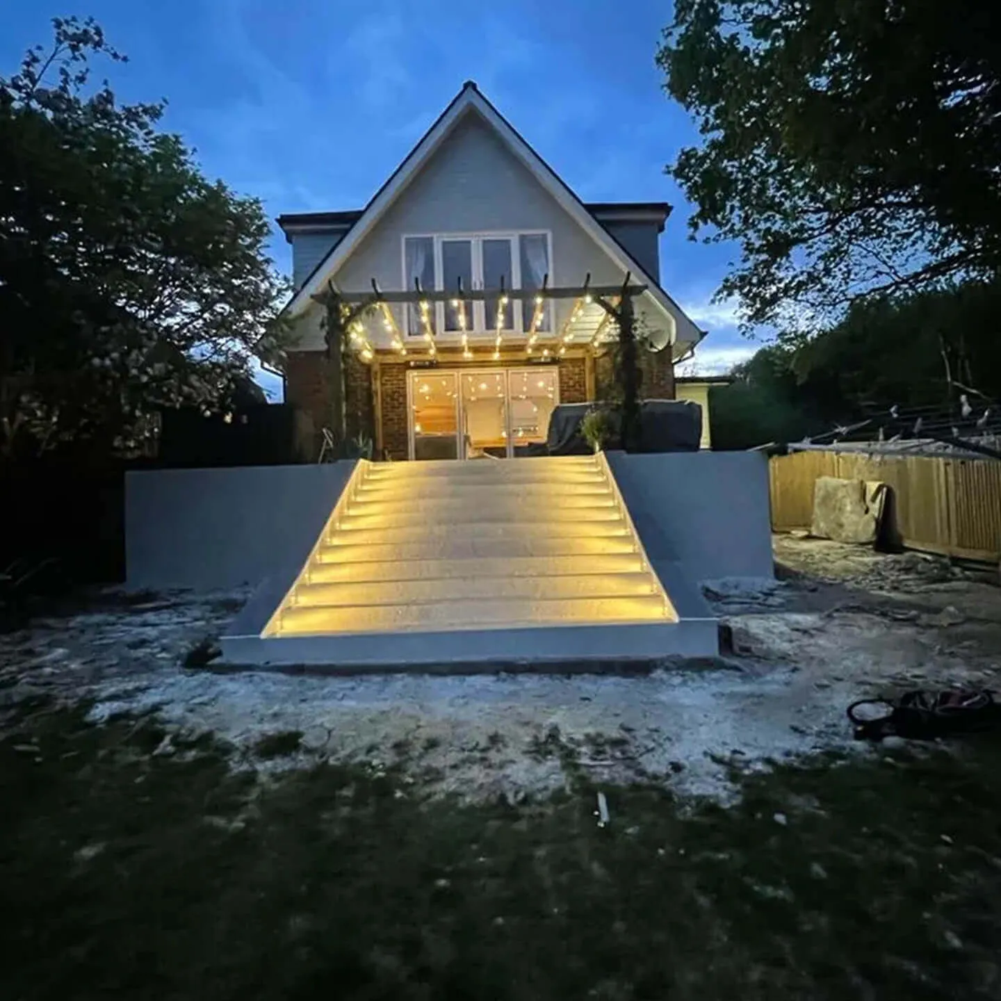 full view of house and stairs with lights